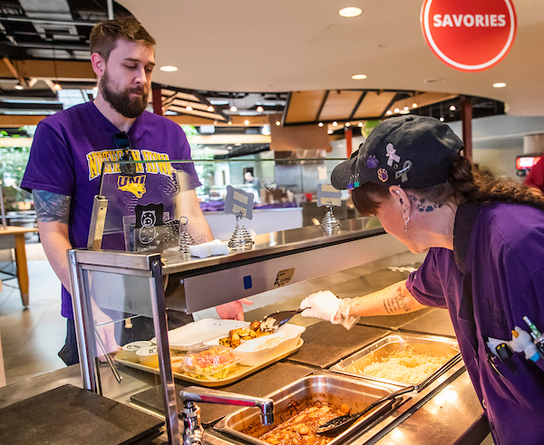 Dining Staff serving student hot food
